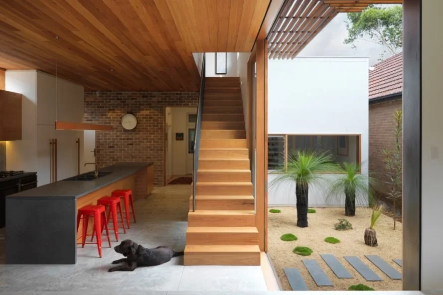 Anderson Architecture revamps a dim heritage home into a modern sun-soaked abode