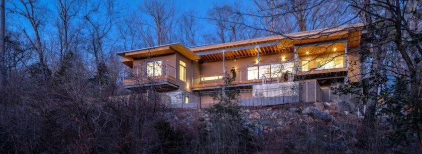 Distinctly modern net-zero home sits in harmony with its woodland surroundings