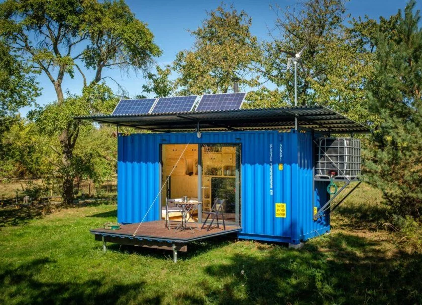The Gaia off-grid container house has a custom rooftop wind turbine