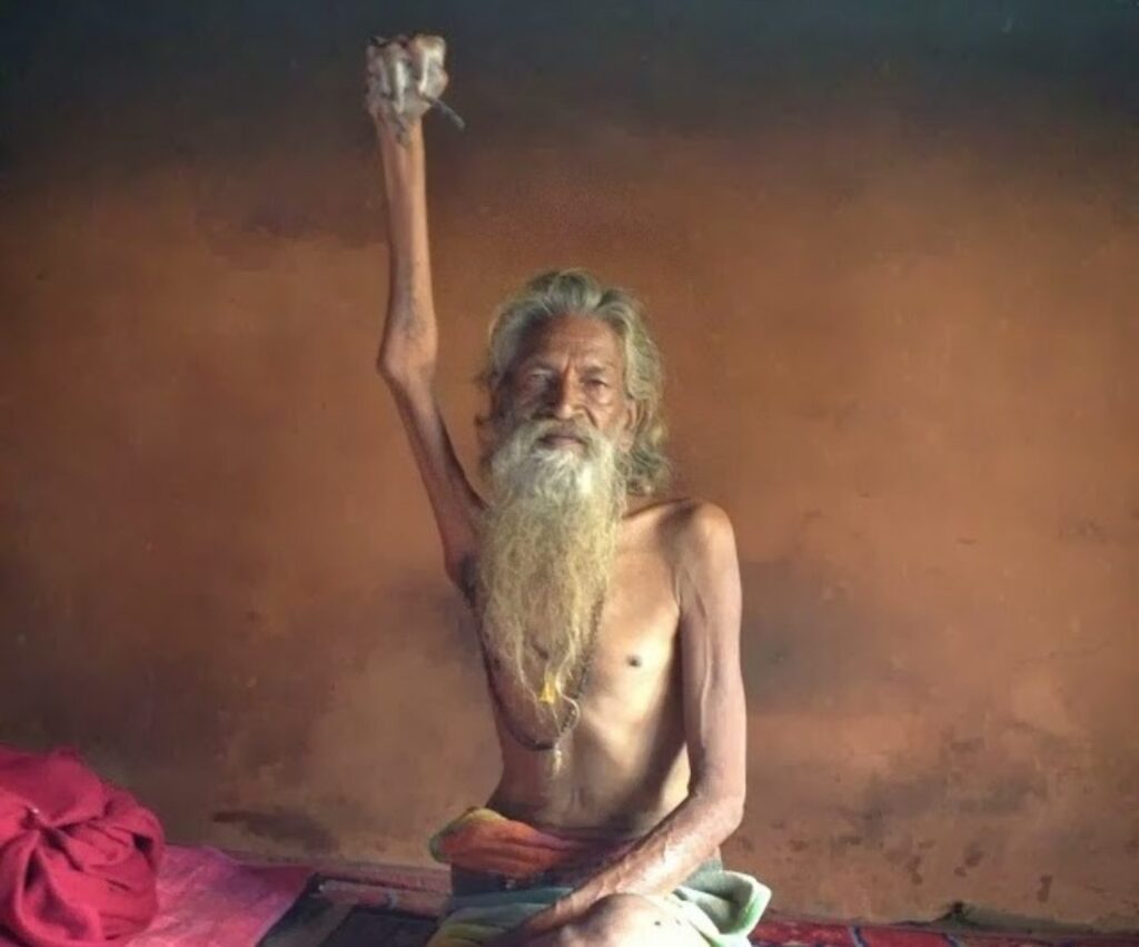 The Indian Ascetic Holding His Arm Up for World Peace Since 1973￼