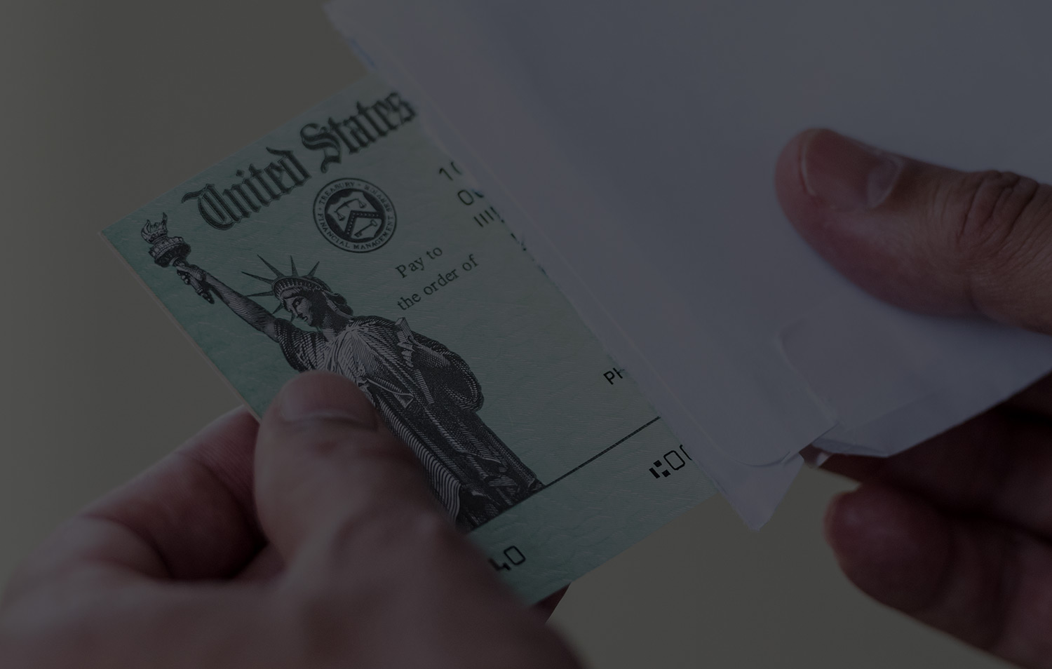 Hands opening check from IRS