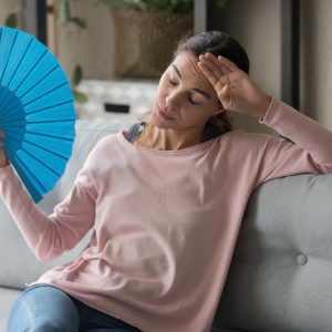 uncomfortable-home Woman hot in home